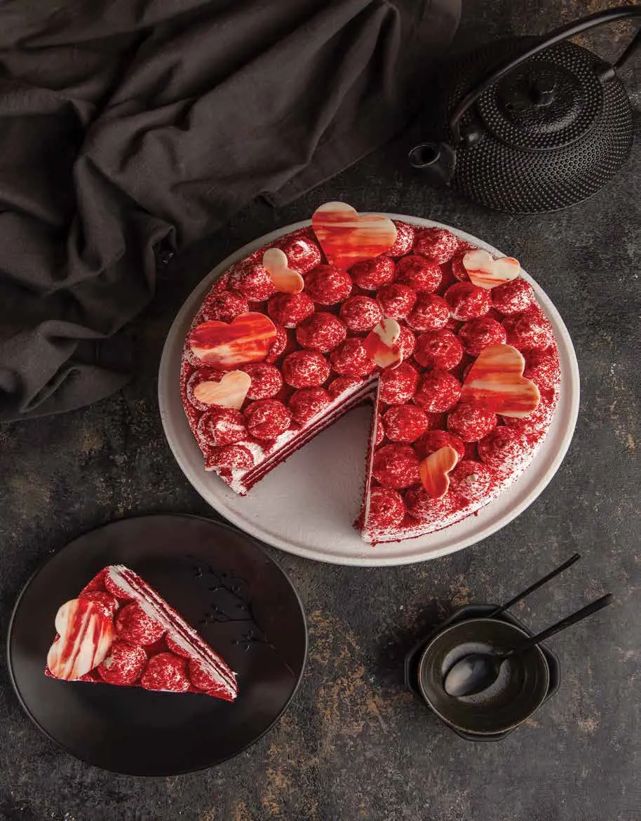 Red velvet cake with a slice served